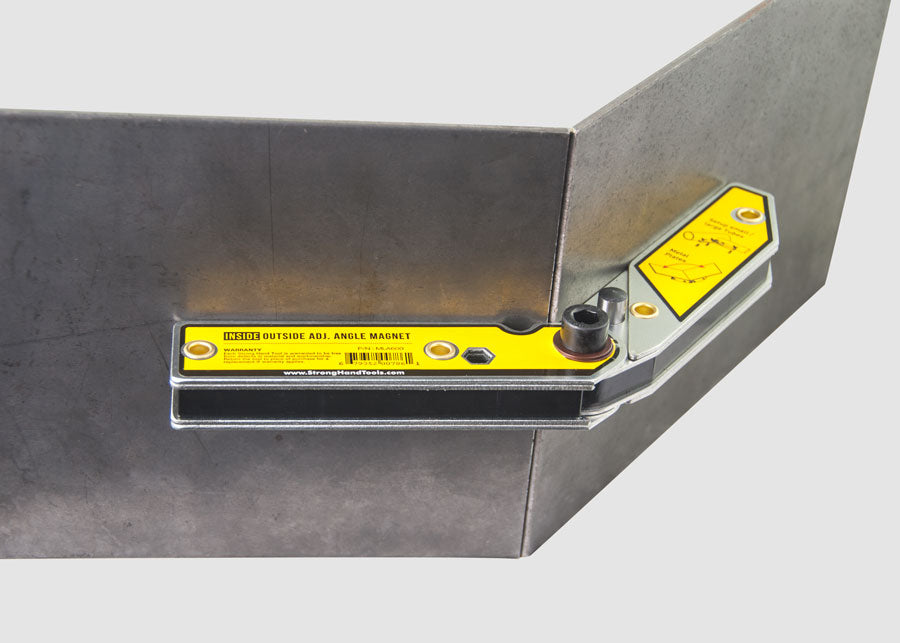 Adjustable magnetic welding angle holder positioned on the outside of a metal corner